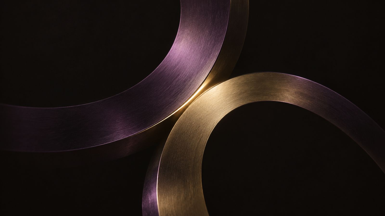 Abstract illustration: two interlocking rings, one purple and one gold, overlapping at a single point